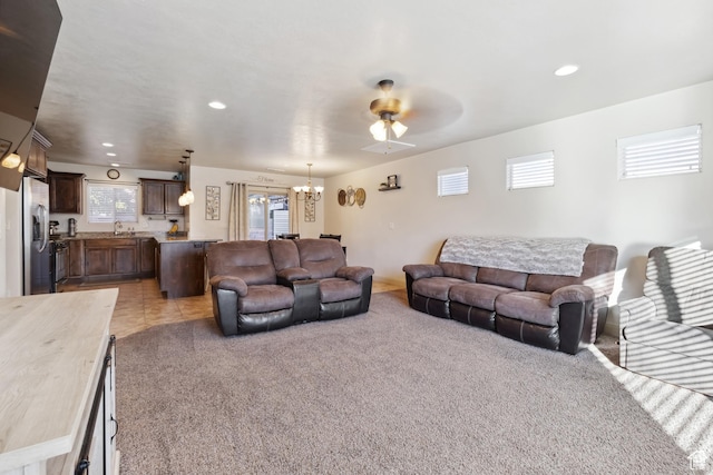 6212 W 100 S, Hurricane, UT 84737 - carpeted living area with a ceiling fan, a sink, tile patterned flooring, and recessed lighting
