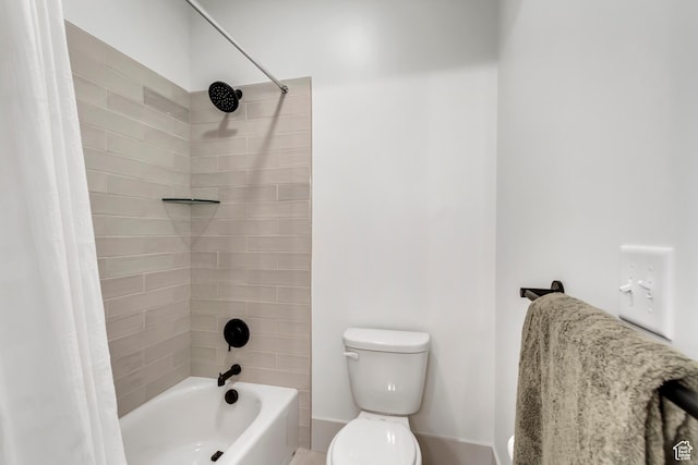 bathroom with toilet and shower / tub combo