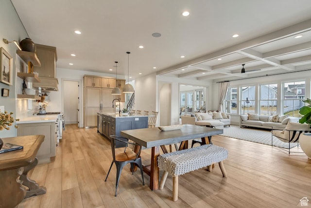 dining space featuring coffered ceiling, light wood-style flooring, recessed lighting, and beam ceiling