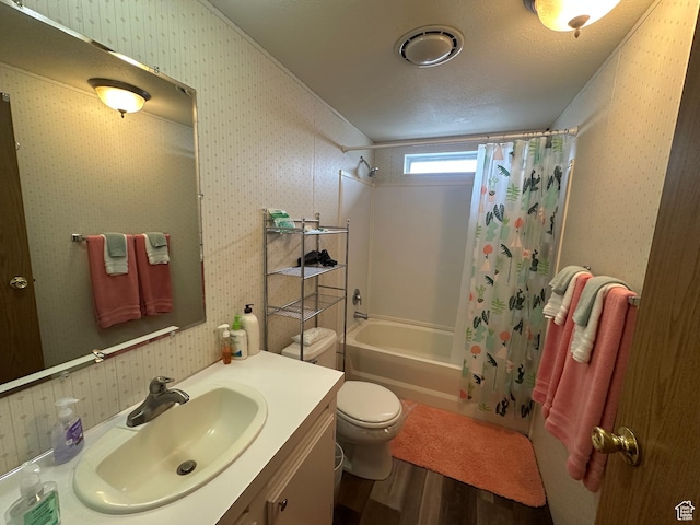 3068 S Monarch Cir Unit 343, Garden City, UT 84028 - bathroom featuring wood finished floors, shower / bath combination with curtain, vanity, and wallpapered walls