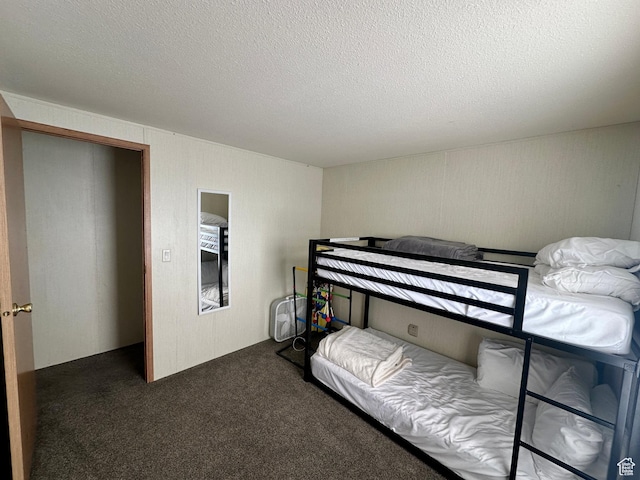 3068 S Monarch Cir Unit 343, Garden City, UT 84028 - bedroom featuring carpet and a textured ceiling