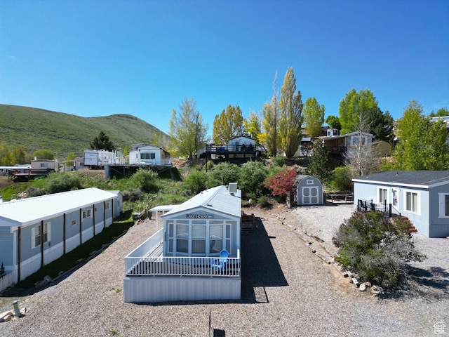 3068 S Monarch Cir Unit 343, Garden City, UT 84028 - view of yard with a storage shed and a mountain view