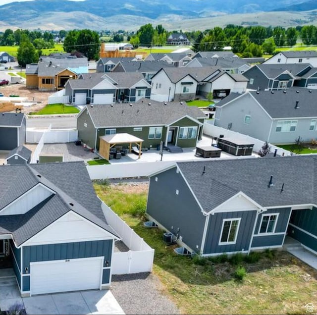 drone / aerial view with a residential view and a mountain view