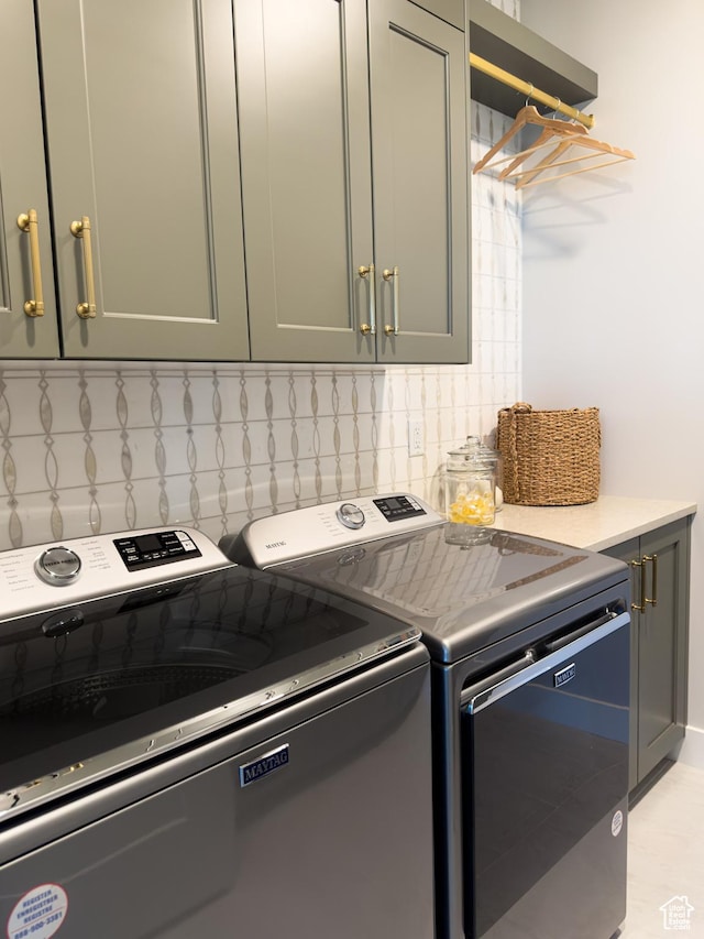 4436 W 1050 S Unit 104, West Point, UT 84015 - laundry room with cabinet space and washer and clothes dryer