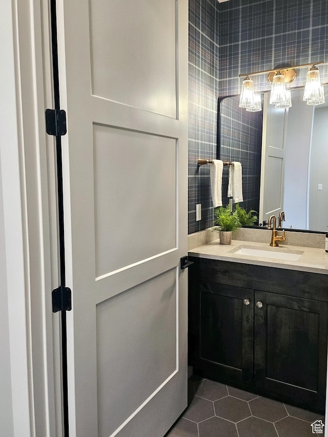 4436 W 1050 S Unit 104, West Point, UT 84015 - bathroom featuring tile patterned floors, vanity, and tile walls