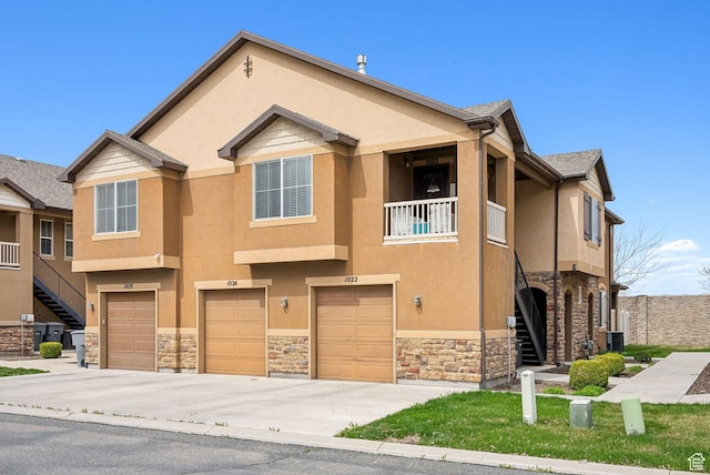 1022 W Allington Dr N, North Salt Lake, UT 84054 - multi unit property with stone siding, stucco siding, and an attached garage