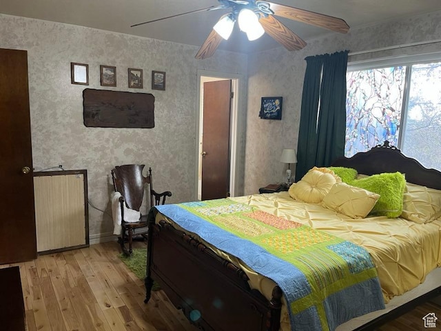 1213 N Winston Dr, Kaysville, UT 84037 - bedroom featuring light wood-style flooring, wallpapered walls, and ceiling fan