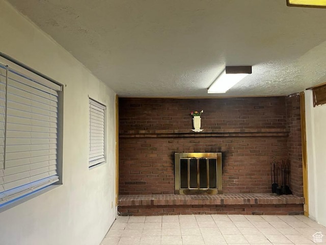 1213 N Winston Dr, Kaysville, UT 84037 - unfurnished living room featuring a fireplace, a textured ceiling, and tile patterned floors