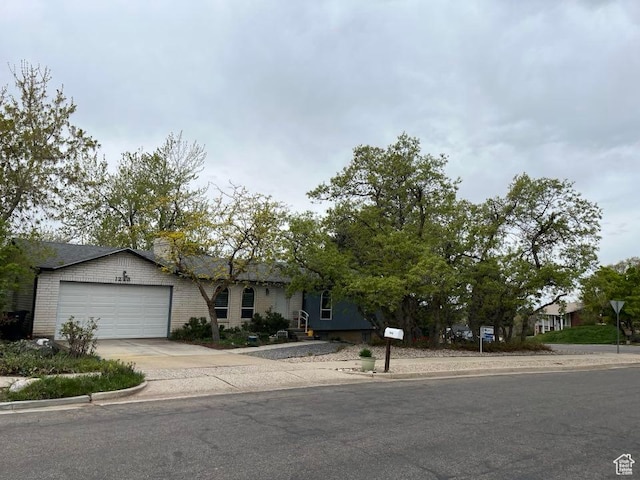 1213 N Winston Dr, Kaysville, UT 84037 - view of front of home with an attached garage and driveway