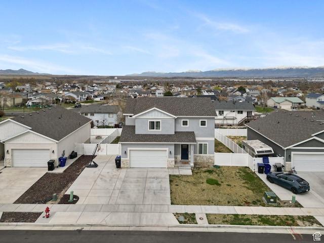 7756 W Bellfield Rd, Magna, UT 84044 - view of front facade with stone siding, a residential view, driveway, and fence