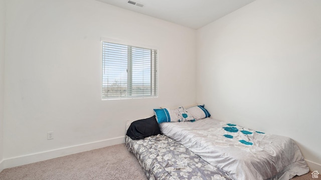 7756 W Bellfield Rd, Magna, UT 84044 - bedroom with baseboards, carpet flooring, and visible vents