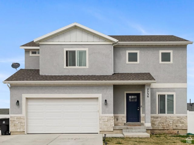 view of front of house featuring stone siding, driveway, a garage, and a shingled roof