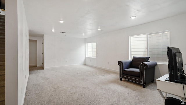 7756 W Bellfield Rd, Magna, UT 84044 - living area featuring light carpet, baseboards, stairs, and recessed lighting