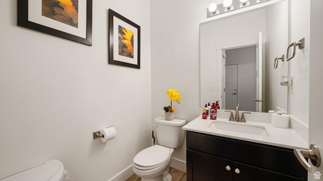 7756 W Bellfield Rd, Magna, UT 84044 - half bath featuring baseboards, toilet, and vanity