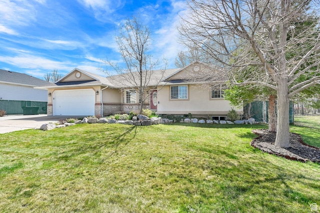 ranch-style house featuring an attached garage, driveway, stucco siding, and a front yard