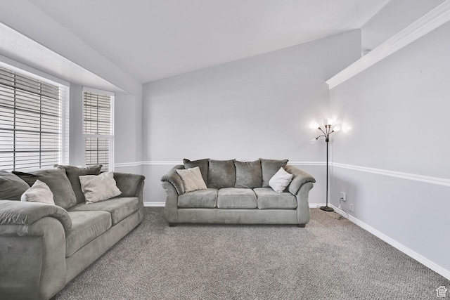 carpeted living area with baseboards and vaulted ceiling
