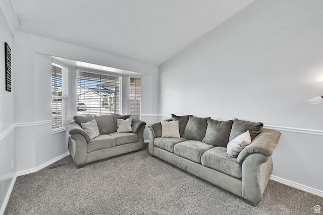carpeted living room featuring baseboards and lofted ceiling
