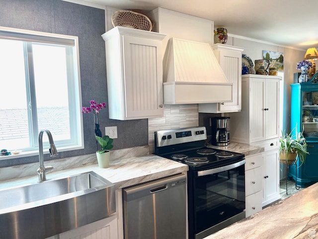 3203 S Nina Loop, Garden City, UT 84028 - kitchen featuring white cabinetry, a sink, stainless steel appliances, and custom range hood
