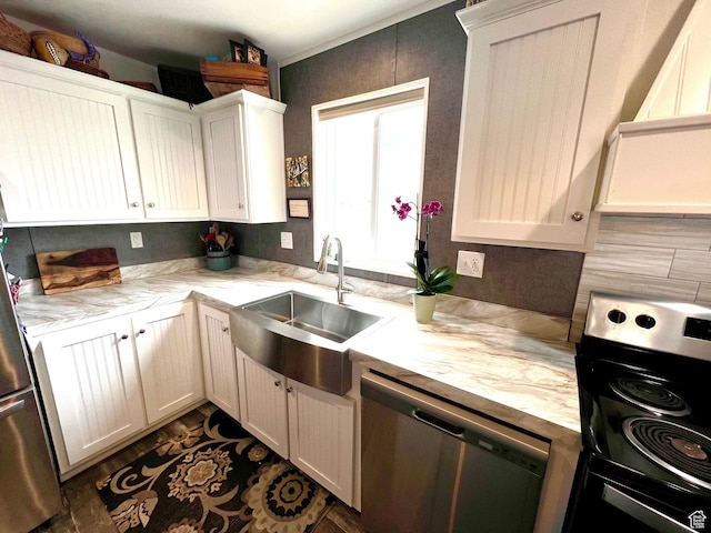 3203 S Nina Loop, Garden City, UT 84028 - kitchen featuring white cabinetry, light countertops, a sink, and stainless steel appliances