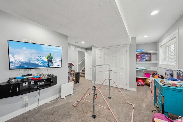 recreation room with carpet, baseboards, and recessed lighting