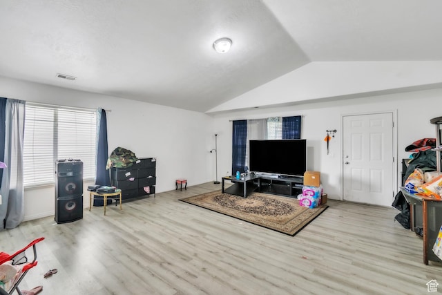 3127 W 525 N, West Point, UT 84015 - living area featuring visible vents, wood finished floors, and vaulted ceiling