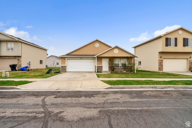 3127 W 525 N, West Point, UT 84015 - view of front facade with driveway, stone siding, a front lawn, and stucco siding