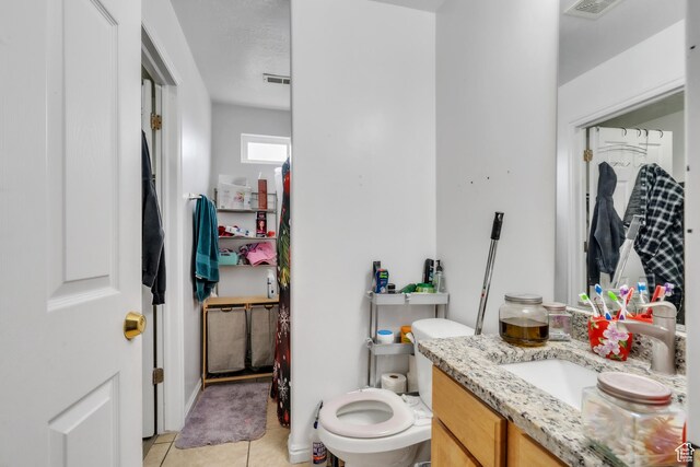 3127 W 525 N, West Point, UT 84015 - bathroom featuring tile patterned floors, visible vents, toilet, and vanity