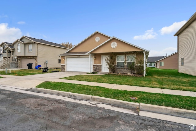 3127 W 525 N, West Point, UT 84015 - view of front of house with concrete driveway, stucco siding, stone siding, a front yard, and a garage