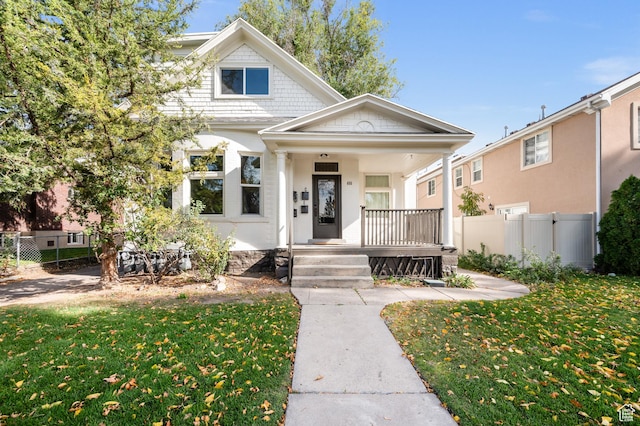 655 S 800 E, Salt Lake City, UT 84102 - view of front of home with a front yard, covered porch, and fence