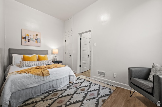 655 S 800 E, Salt Lake City, UT 84102 - bedroom featuring visible vents, baseboards, and wood finished floors