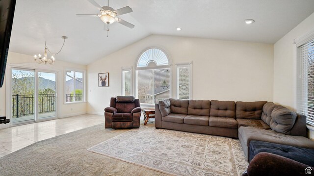 2484 Oakridge Dr, Spanish Fork, UT 84660 - living area featuring vaulted ceiling, a healthy amount of sunlight, tile patterned flooring, and ceiling fan with notable chandelier