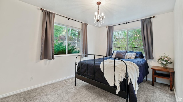 2484 Oakridge Dr, Spanish Fork, UT 84660 - carpeted bedroom featuring baseboards and a notable chandelier