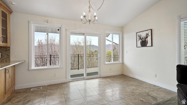 2484 Oakridge Dr, Spanish Fork, UT 84660 - unfurnished dining area featuring a notable chandelier, lofted ceiling, light tile patterned floors, baseboards, and visible vents