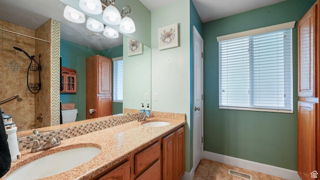 2484 Oakridge Dr, Spanish Fork, UT 84660 - full bathroom with a sink, visible vents, and plenty of natural light