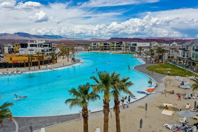 5399 S Cerulean Ln Unit 95, St George, UT 84790 - community pool with a mountain view, fence, and a residential view