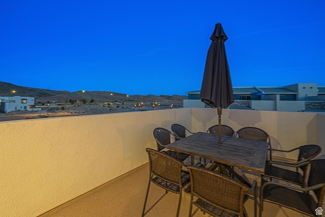 5399 S Cerulean Ln Unit 95, St George, UT 84790 - view of patio with a balcony, outdoor dining space, and a mountain view