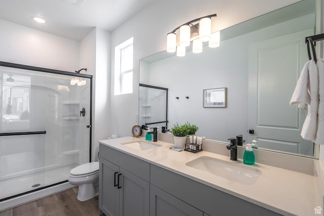5399 S Cerulean Ln Unit 95, St George, UT 84790 - bathroom with a shower stall, wood finished floors, toilet, and a sink