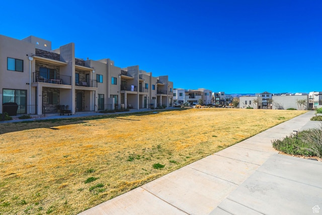 5399 S Cerulean Ln Unit 95, St George, UT 84790 - surrounding community featuring a lawn and a residential view