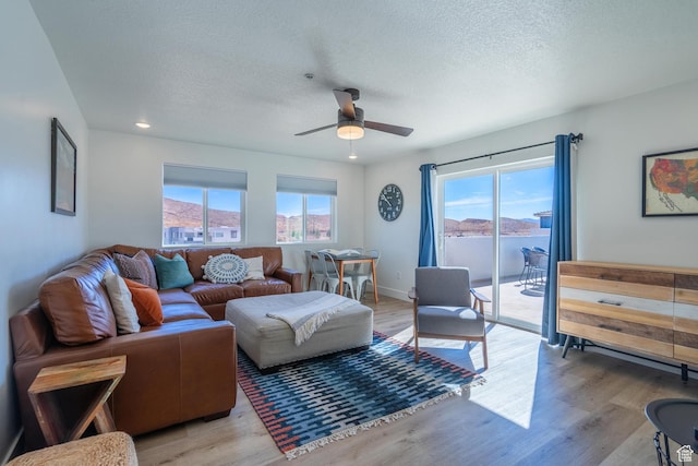 5399 S Cerulean Ln Unit 95, St George, UT 84790 - living area with ceiling fan, light wood-style flooring, and a healthy amount of sunlight