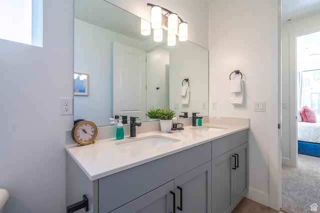 5399 S Cerulean Ln Unit 95, St George, UT 84790 - bathroom with connected bathroom, double vanity, baseboards, and a sink