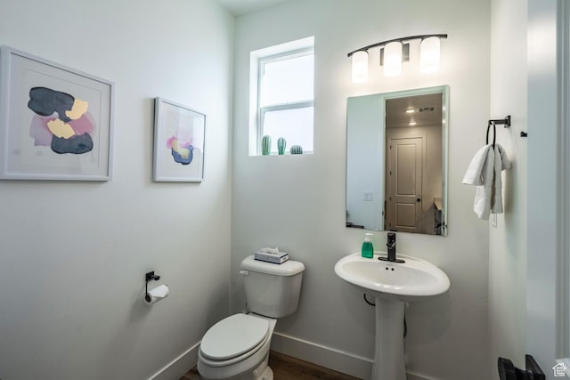 5399 S Cerulean Ln Unit 95, St George, UT 84790 - half bathroom with baseboards, wood finished floors, and toilet