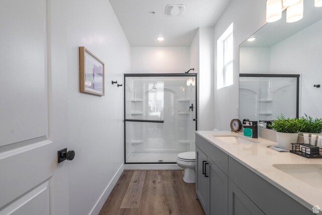 5399 S Cerulean Ln Unit 95, St George, UT 84790 - bathroom featuring a sink, toilet, a stall shower, and wood finished floors