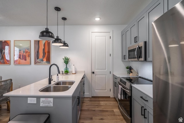 5399 S Cerulean Ln Unit 95, St George, UT 84790 - kitchen with a sink, gray cabinetry, appliances with stainless steel finishes, and a peninsula