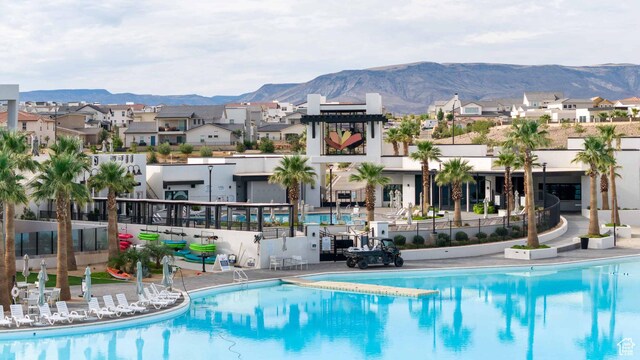 5399 S Cerulean Ln Unit 95, St George, UT 84790 - community pool featuring a residential view, a mountain view, fence, and a patio