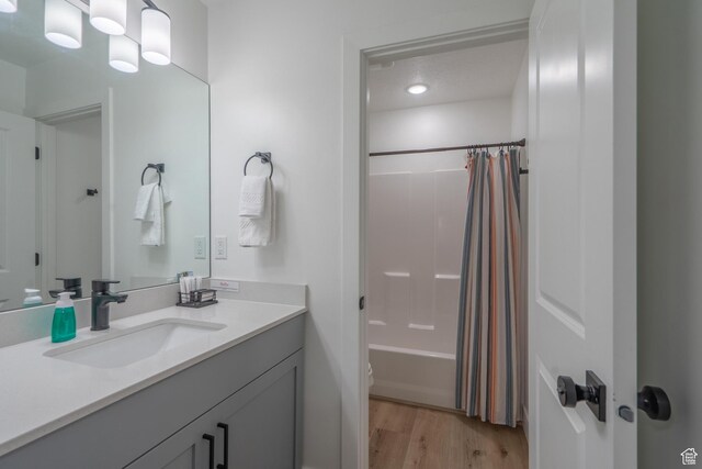 5399 S Cerulean Ln Unit 95, St George, UT 84790 - full bath featuring wood finished floors, shower / tub combo, and vanity