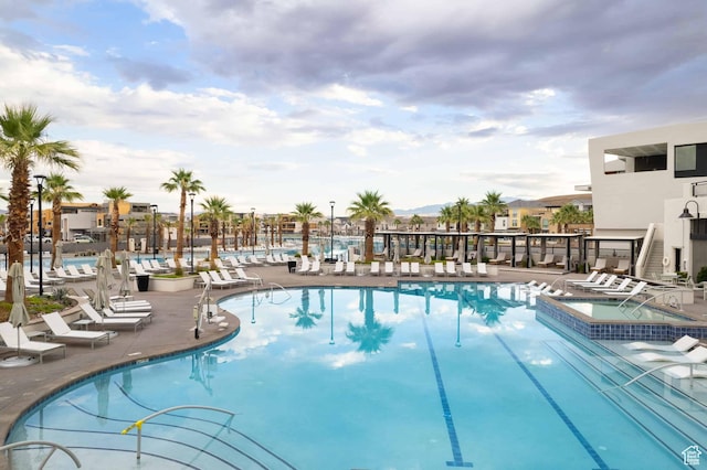 5399 S Cerulean Ln Unit 95, St George, UT 84790 - view of swimming pool featuring a pool with connected hot tub and a patio