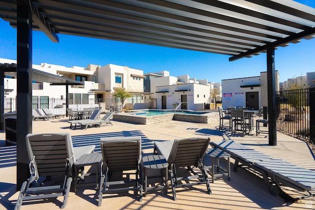 5399 S Cerulean Ln Unit 95, St George, UT 84790 - view of patio / terrace with a community hot tub, fence, a fenced in pool, and a residential view
