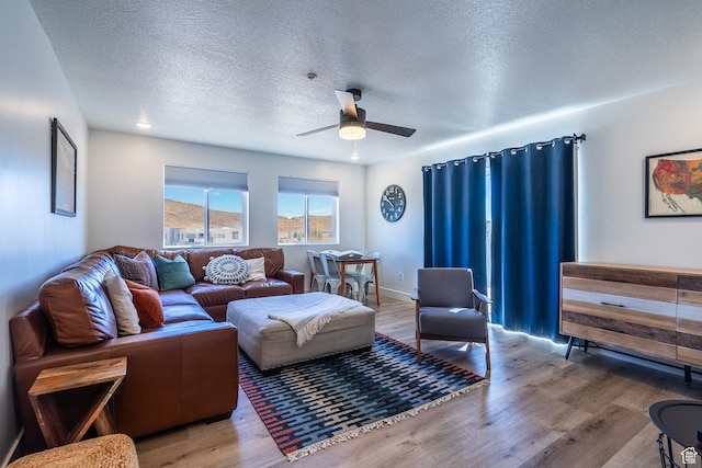 5399 S Cerulean Ln Unit 95, St George, UT 84790 - living area with baseboards, wood finished floors, ceiling fan, and a textured ceiling