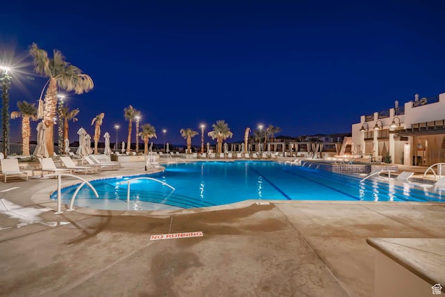 5399 S Cerulean Ln Unit 95, St George, UT 84790 - pool at twilight featuring a community pool and a patio
