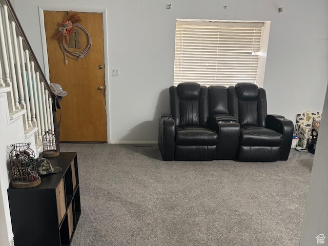 living area with carpet floors and stairway